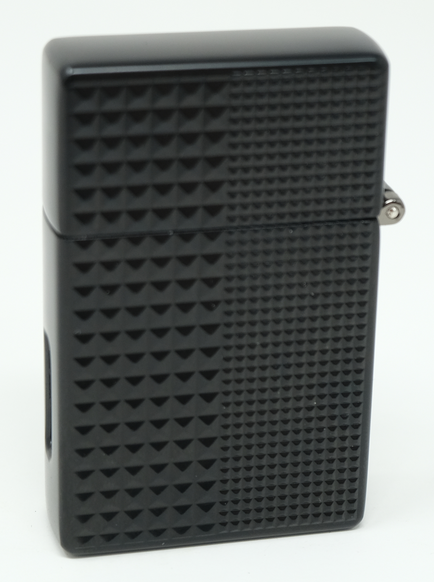 Closed Magic Lighter showing the full pyramid-cut textured face